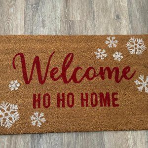 Coir Doormat with " Welcome HO HO Home" and snowflakes printed on it